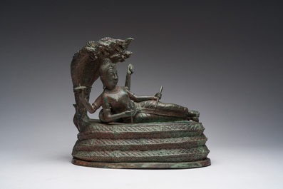 Indian school: Vishnu resting on Shesha or Ananta Shesha, king of the nagas, patinated bronze, 19th C.