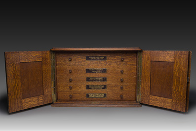 A Belgian oak cutlery case with a 227-piece silver cutlery set, 800/000, Wolfers, 20th C.