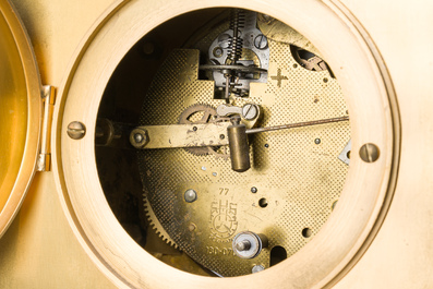 Two gilt bronze mantel clocks and a pair of four-light caryatid-shaped candlesticks, France and Germany, 19th/20th C.