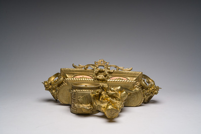 Two gilt bronze mantel clocks and a pair of four-light caryatid-shaped candlesticks, France and Germany, 19th/20th C.