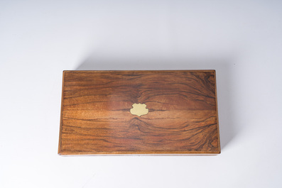 A French dueling box containing a pair of percussion pistols with damask barrels and engraved breechblocks, 19th C.