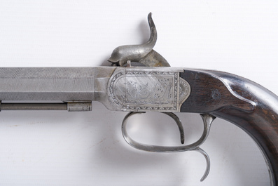 A French dueling box containing a pair of percussion pistols with damask barrels and engraved breechblocks, 19th C.