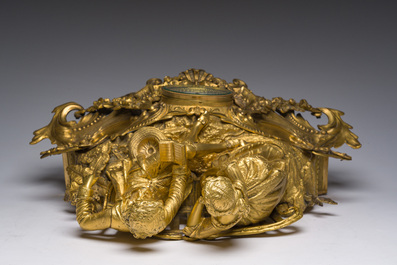 A French gilt bronze mantel clock crowned by a couple in love chatting on a bench, 19th C.