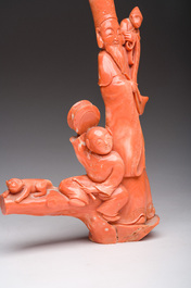 A Chinese red coral group with a scholar, his servant and a monkey, two-character mark, 19th C.