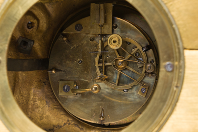 A French gilt bronze mantel clock crowned by a couple in love chatting on a bench, 19th C.