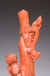 A Chinese red coral group with a scholar, his servant and a monkey, two-character mark, 19th C.