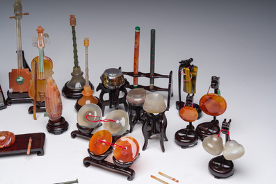 A Chinese collection of agate carved musical instruments with an accompanying presentation box, Republic, 20th C.
