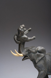 Illegibly signed: An elephant attacked by two tigers, zamak on a marble and onyx base, second quarter 20th C.