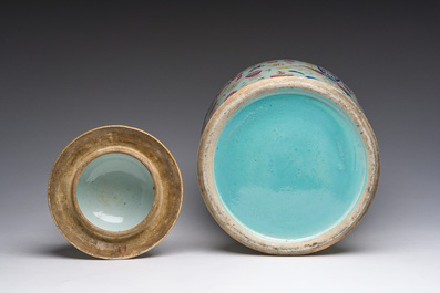 A Chinese famille rose 'antiquities' vase and cover, 19th C.