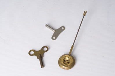 Two gilt bronze mantel clocks and a pair of four-light caryatid-shaped candlesticks, France and Germany, 19th/20th C.