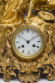 A French gilt bronze mantel clock crowned by a couple in love chatting on a bench, 19th C.