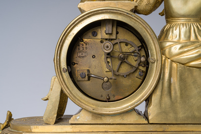 Two gilt bronze mantel clocks and a pair of four-light caryatid-shaped candlesticks, France and Germany, 19th/20th C.