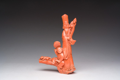 A Chinese red coral group with a scholar, his servant and a monkey, two-character mark, 19th C.