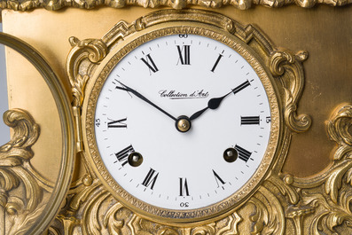 Two gilt bronze mantel clocks and a pair of four-light caryatid-shaped candlesticks, France and Germany, 19th/20th C.