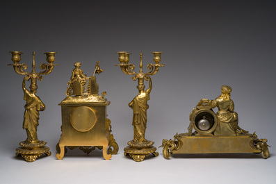 Two gilt bronze mantel clocks and a pair of four-light caryatid-shaped candlesticks, France and Germany, 19th/20th C.