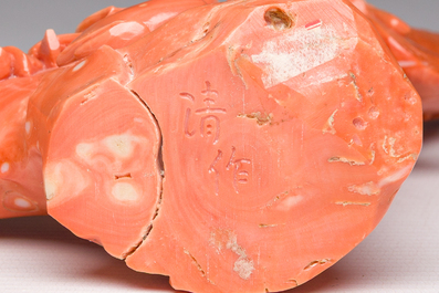 A Chinese red coral group with a scholar, his servant and a monkey, two-character mark, 19th C.