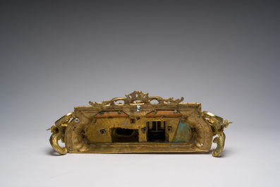 Two gilt bronze mantel clocks and a pair of four-light caryatid-shaped candlesticks, France and Germany, 19th/20th C.