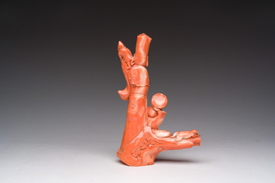 A Chinese red coral group with a scholar, his servant and a monkey, two-character mark, 19th C.