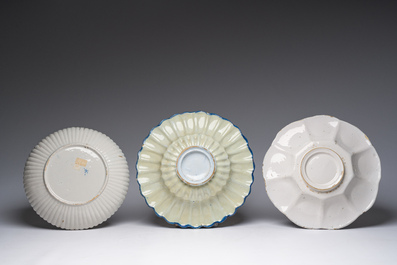 Five blue, white and polychrome Dutch Delft dishes, a lamp-mounted vase and a Brussels faience tobacco jar, 17th/19th C.