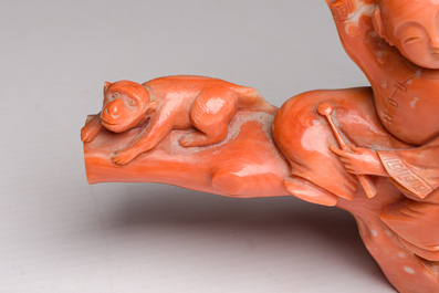 A Chinese red coral group with a scholar, his servant and a monkey, two-character mark, 19th C.