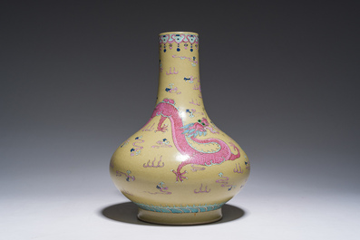 A Chinese famille rose enamelled teadust-glazed bottle vase with dragons, Qianlong mark, 19th C.