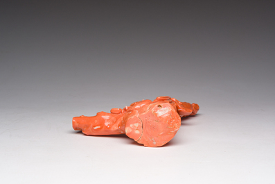 A Chinese red coral group with a scholar, his servant and a monkey, two-character mark, 19th C.