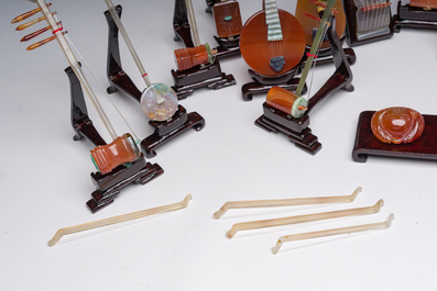 A Chinese collection of agate carved musical instruments with an accompanying presentation box, Republic, 20th C.