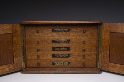 A Belgian oak cutlery case with a 227-piece silver cutlery set, 800/000, Wolfers, 20th C.