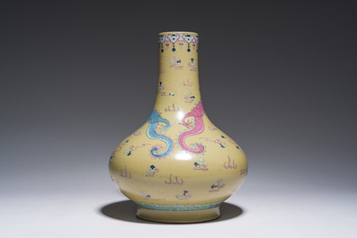 A Chinese famille rose enamelled teadust-glazed bottle vase with dragons, Qianlong mark, 19th C.