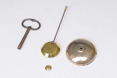 A French gilt bronze mantel clock crowned by a couple in love chatting on a bench, 19th C.