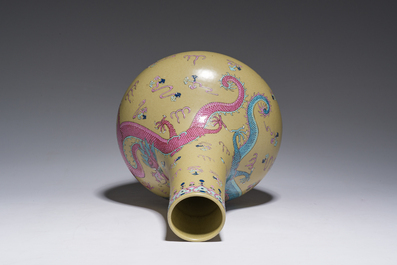 A Chinese famille rose enamelled teadust-glazed bottle vase with dragons, Qianlong mark, 19th C.