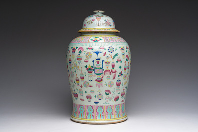 A Chinese famille rose 'antiquities' vase and cover, 19th C.