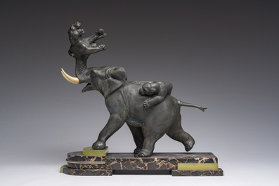 Illegibly signed: An elephant attacked by two tigers, zamak on a marble and onyx base, second quarter 20th C.