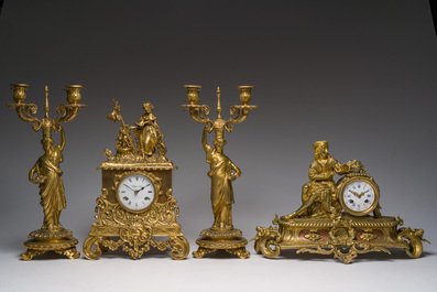 Two gilt bronze mantel clocks and a pair of four-light caryatid-shaped candlesticks, France and Germany, 19th/20th C.