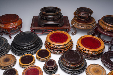 A collection of Chinese wooden stands, 20th C.