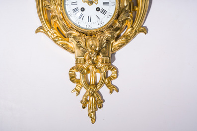 A French gilt bronze Louis XVI style cartel clock with floral design, late 19th C.