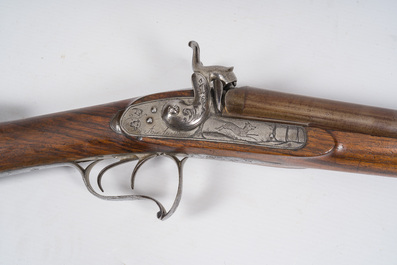 A French double barrel percussion shotgun with damask barrels and engraved breechblocks, marked 'Vrai Tordu Rubans', 19th C.