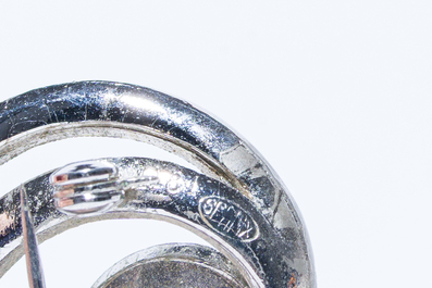 A varied collection of jewelry, including silver brooches and an 18 carat gold ring, 20th C.