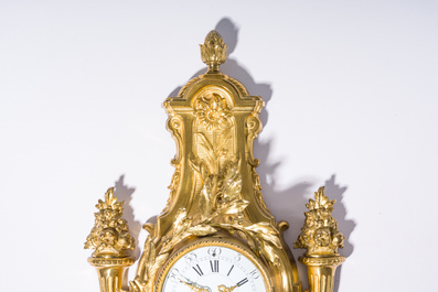 A French gilt bronze Louis XVI style cartel clock with floral design, late 19th C.
