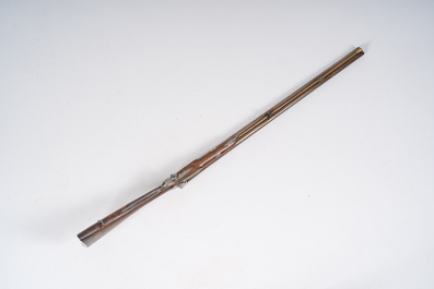 A French double barrel percussion shotgun with damask barrels and engraved breechblocks, marked 'Vrai Tordu Rubans', 19th C.