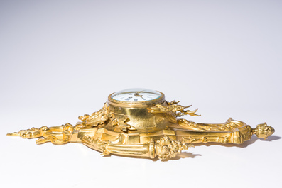 A French gilt bronze Louis XVI style cartel clock with floral design, late 19th C.