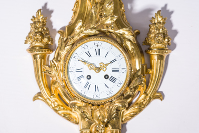 A French gilt bronze Louis XVI style cartel clock with floral design, late 19th C.