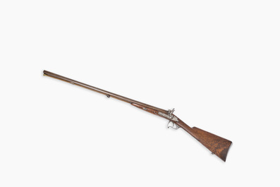 A French double barrel percussion shotgun with damask barrels and engraved breechblocks, marked 'Vrai Tordu Rubans', 19th C.