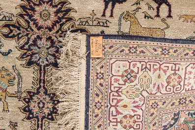 A Persian Qom (Qum/Ghom) silk rug with animals and floral design, 20th C.