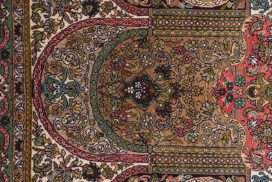 An extremely fine Chinese Hereke style silk rug with floral design, 20th C.
