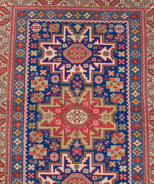An Afghan Shirvan rug with geometric floral design, wool on cotton, mid 20th C.