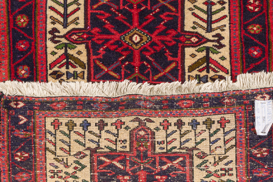 A Persian Heriz Karache runner with geometric design, wool on cotton, mid 20th C.