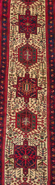 A Persian Heriz Karache runner with geometric design, wool on cotton, mid 20th C.