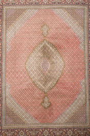 A Persian Tabriz rug with central medallion and floral design, wool on cotton, first half 20th C.