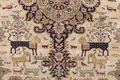 A Persian Qom (Qum/Ghom) silk rug with animals and floral design, 20th C.